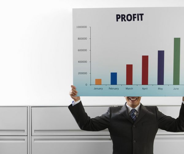 Businessman Holding Graph --- Image by © Royalty-Free/Corbis
